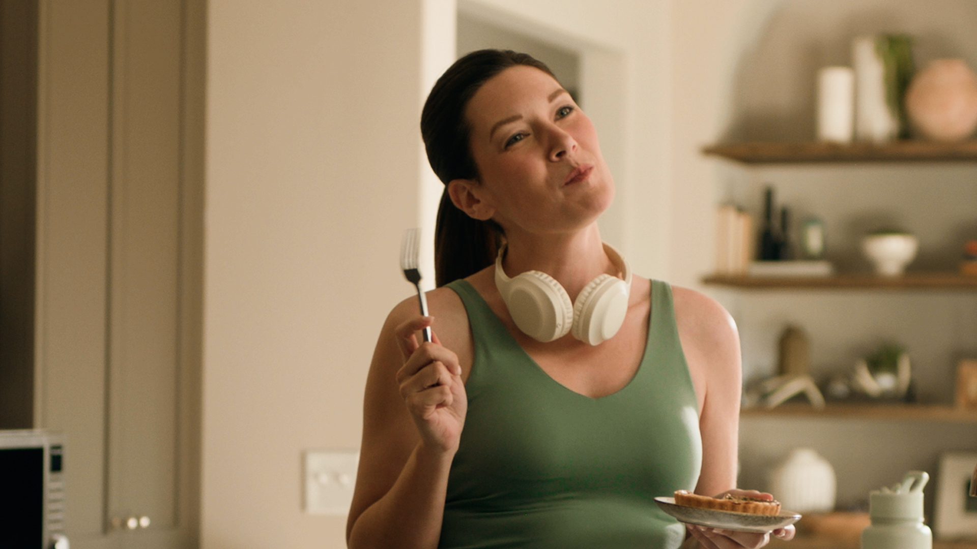 Woman enjoying personal quiche after workout