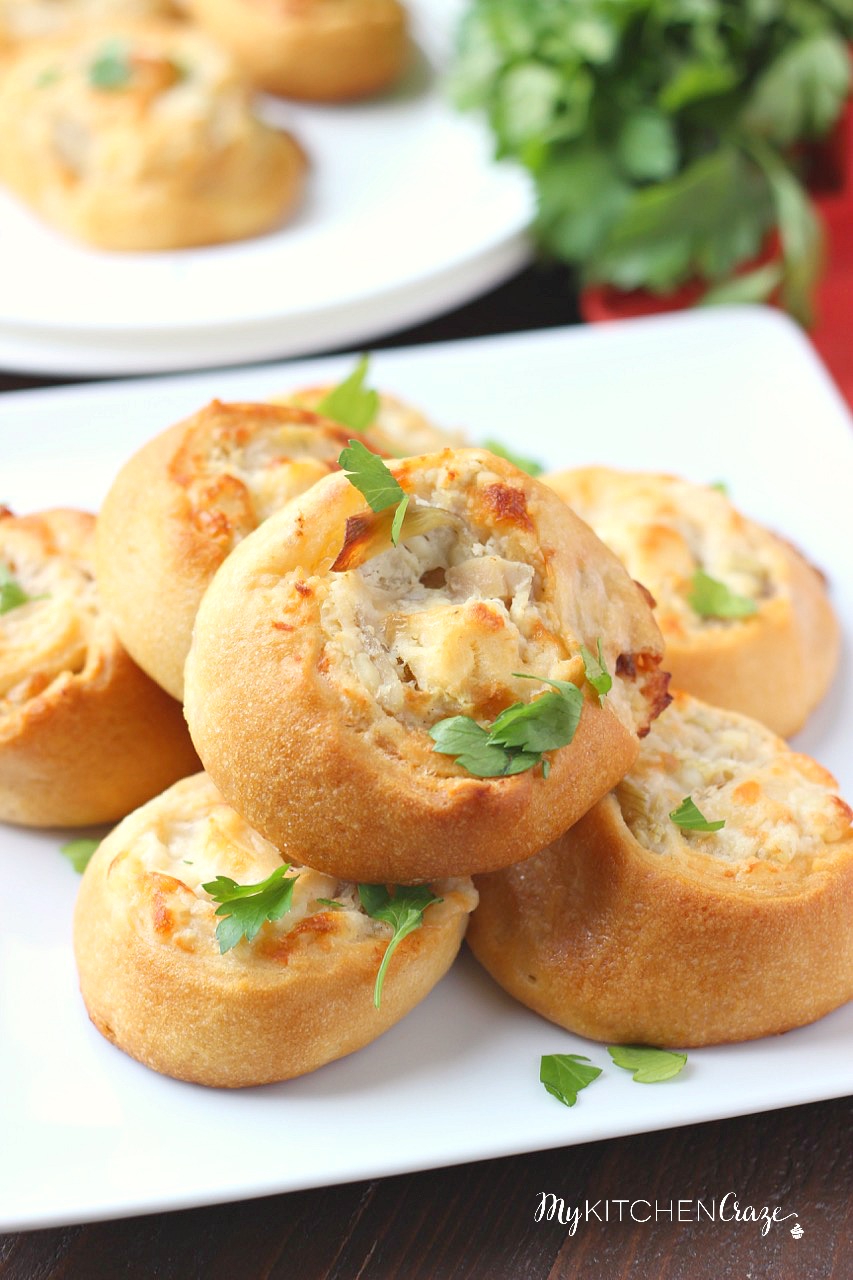 Artichoke Jalapeño Pinwheels stacked on a plate