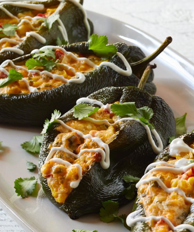 Corn Queso Stuffed Poblano Peppers on a white platter