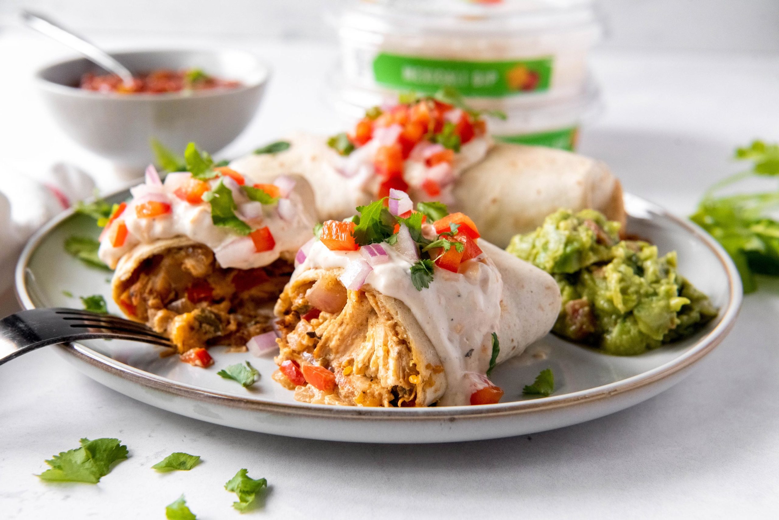 Chicken Chimichangas on a plate with guacamole
