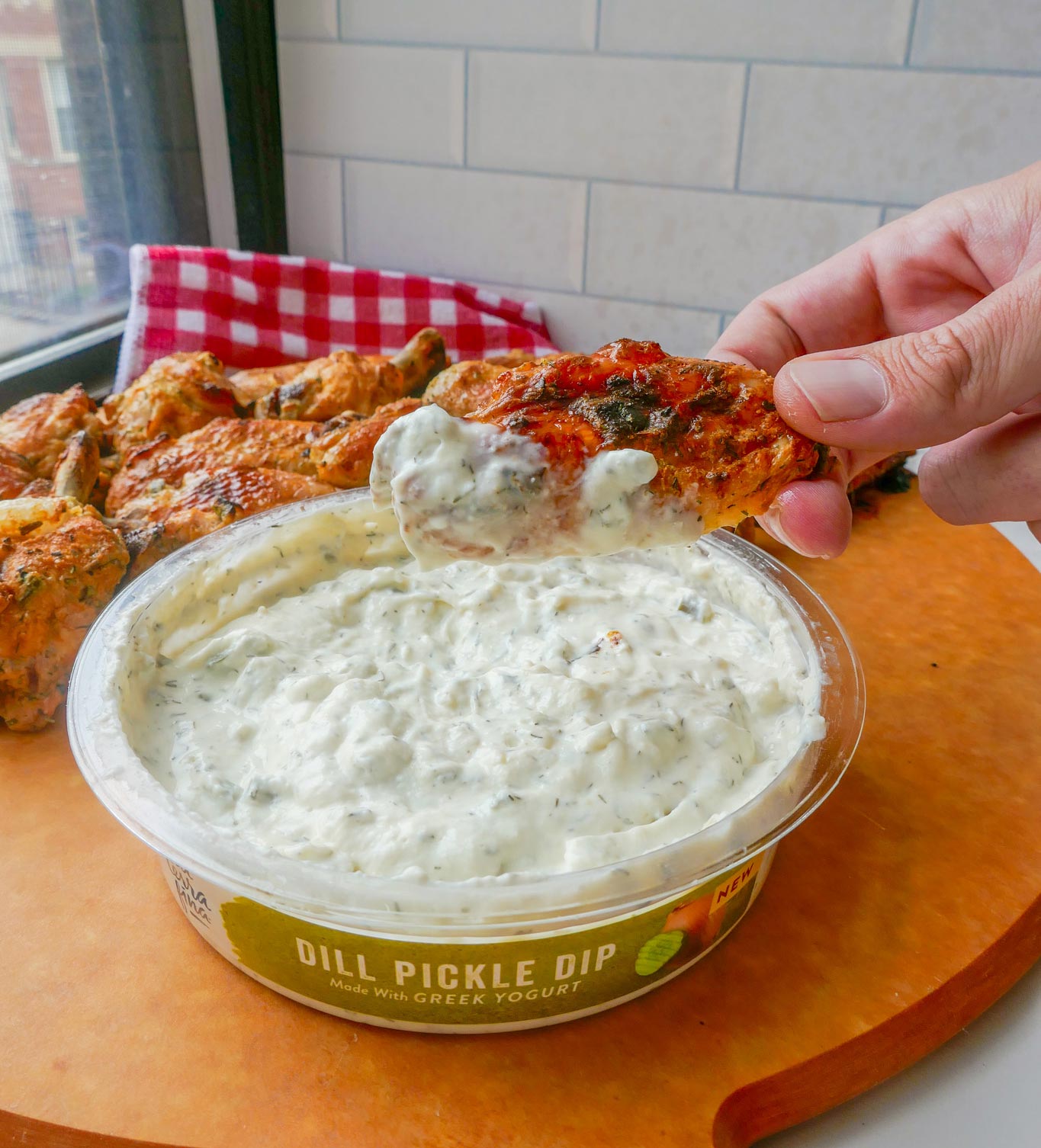 Dill Pickle Marinated Crispy Chicken Wings dipped in Dill Pickle Dip