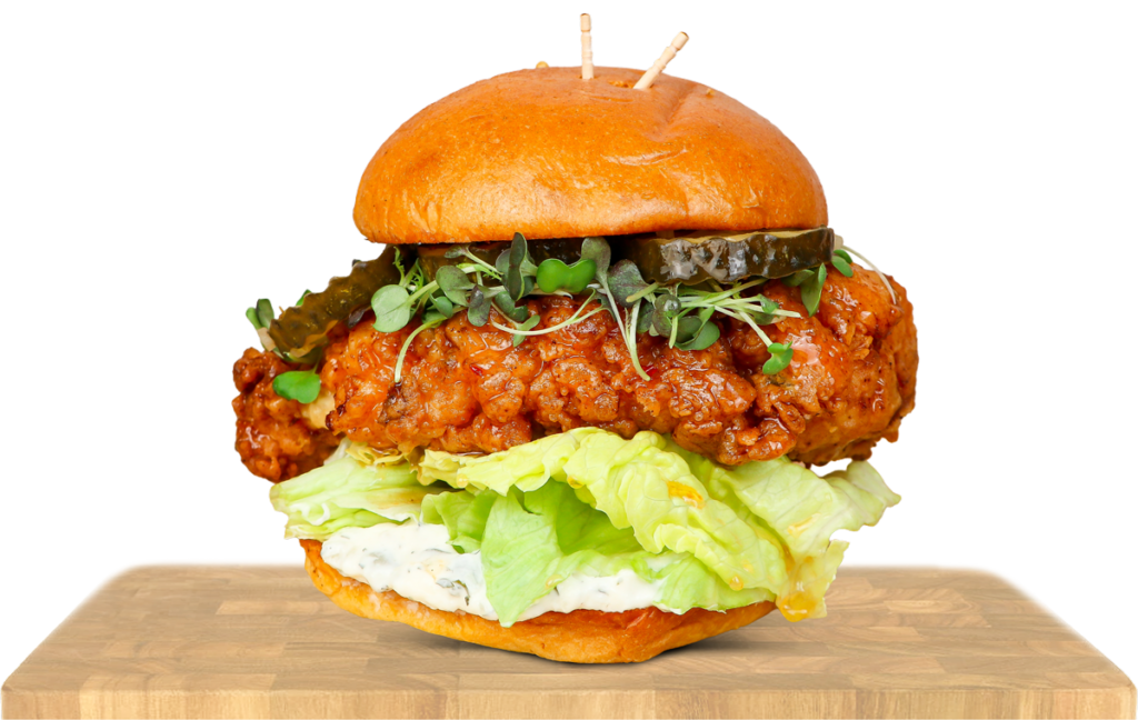 chicken sandwich on a cutting board
